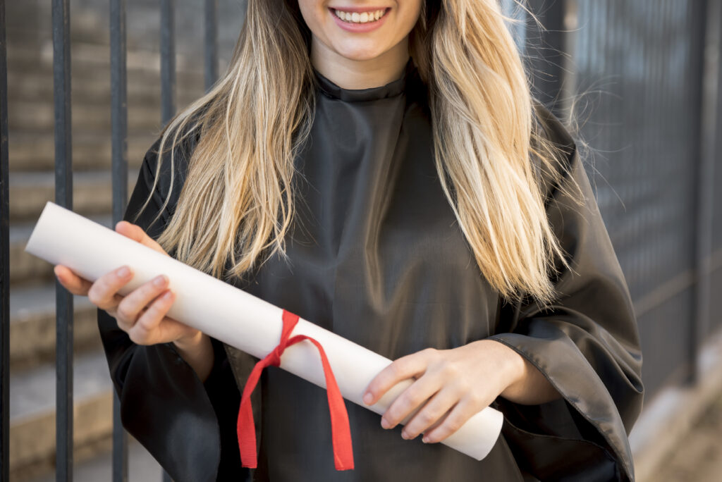 Girl Holding Diploma - Hiring New Grads