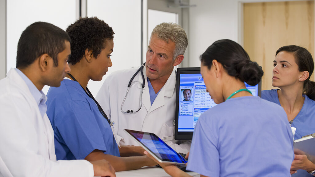 Nursing professionals engaged in a conversation.