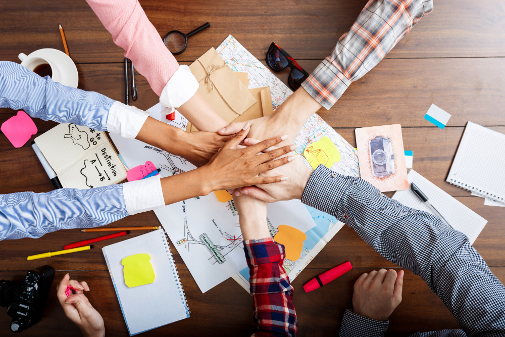 Team members holding hands, showcasing the essence of an employee brand