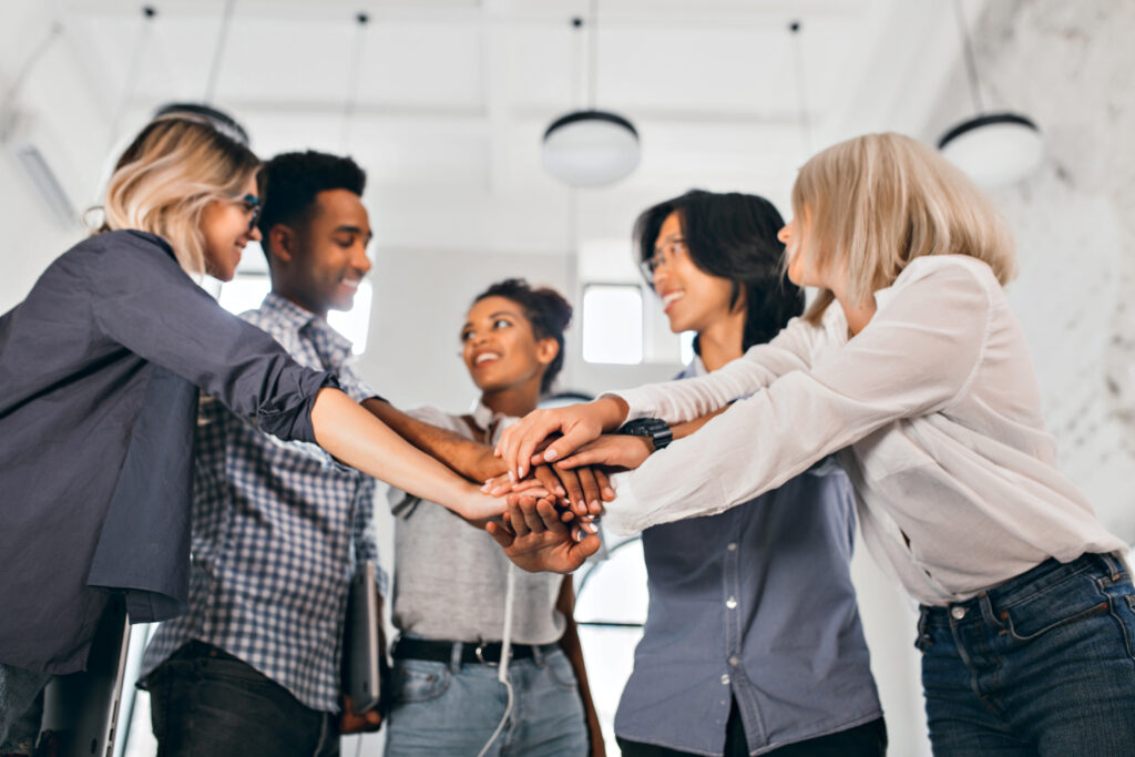 Happy coworkers laughing, epitomizing company culture