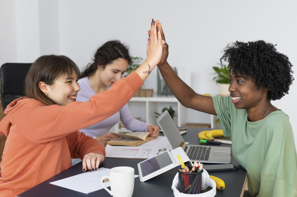  Gen Z individual shaking hands with a recruiter during a recruitment session.