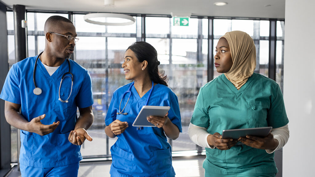Diverse group of nurses showcasing inclusion in nursing recruitment company strategies