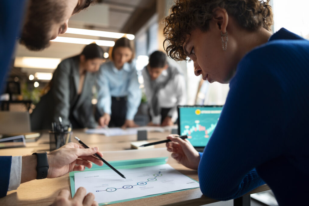 Recruiter reviewing smart goals for recruiters on a clipboard.