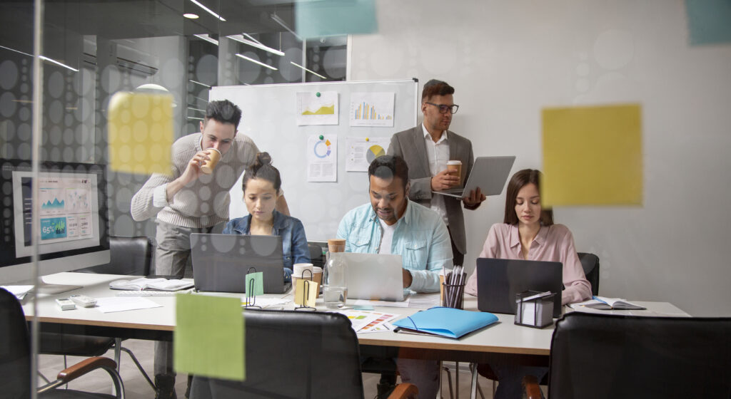 Modern office environment with team meeting, showcasing recruitment marketing dynamics
