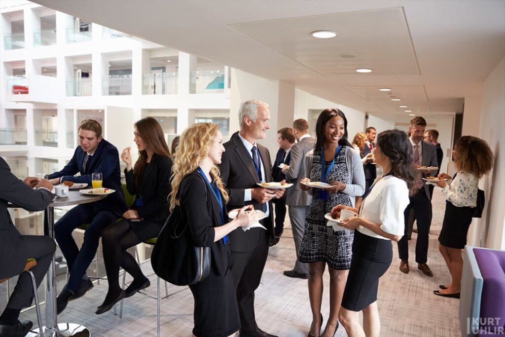 Diverse professionals networking at an industry event, embodying the passive candidate strategy.