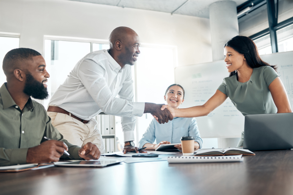 Diverse candidates Diverse candidates shaking hands with their recruiter after an interview..