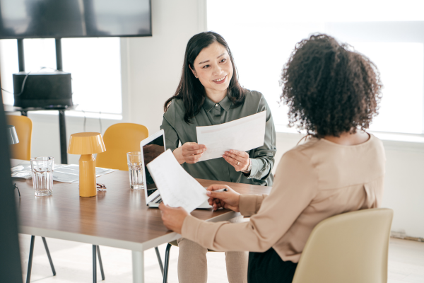 Hiring manager interviewing a candidate, emphasizing the importance of job descriptions.