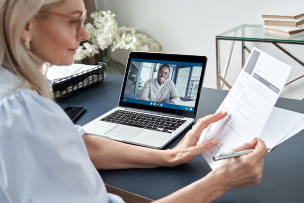 Modern home office setup for a virtual job interview, highlighting the importance of job descriptions in remote work.