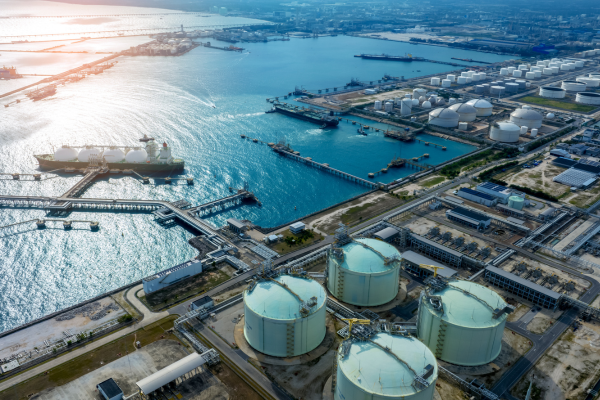 Aerial view of an oil refinery and storage facility, highlighting sustainability efforts in oil and gas recruitment.